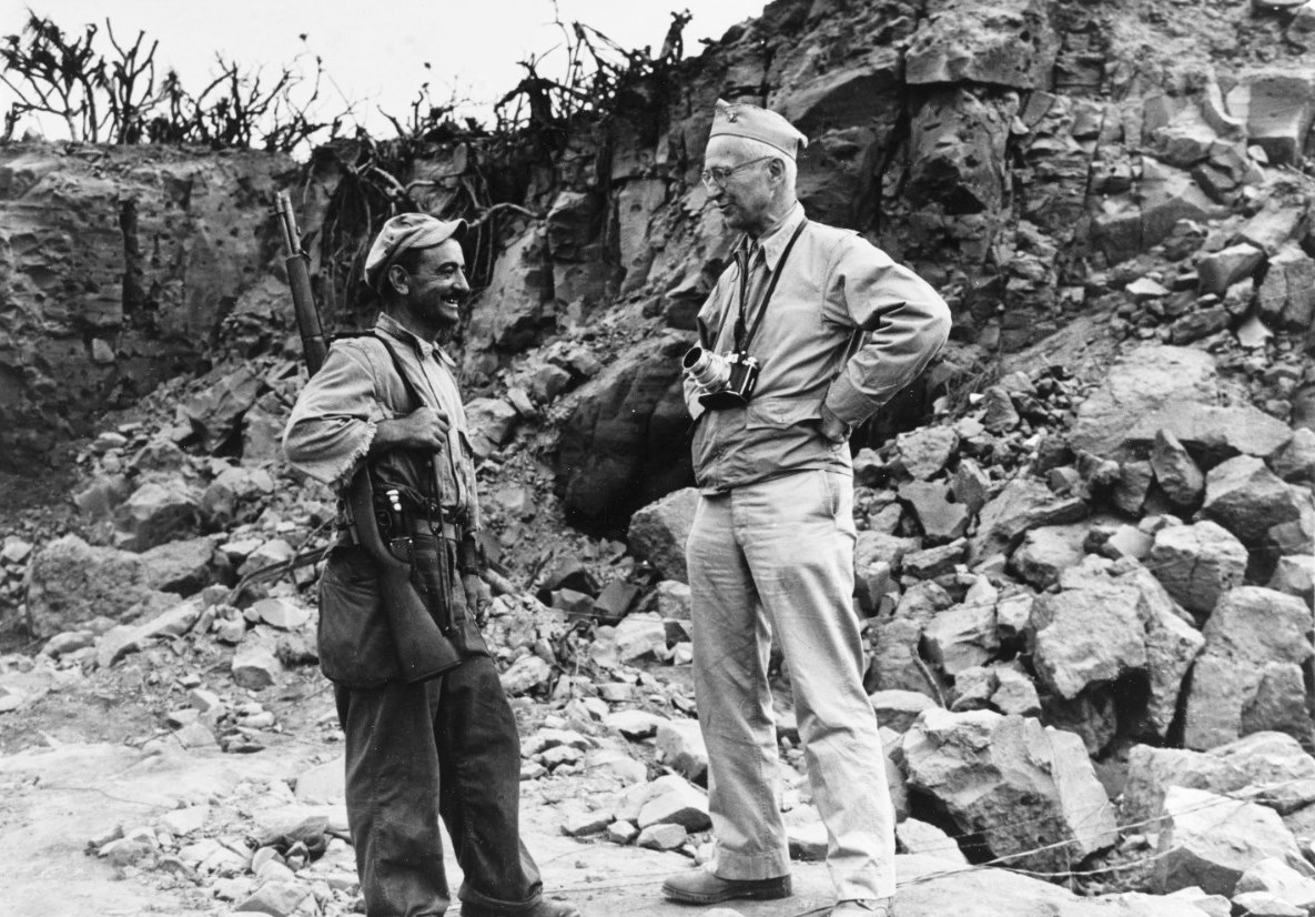 Captain Edward Steichen, head of the Navy’s combat photography and Director of the Naval Photographic Institute, right, speaking with US Marine Corporal William Damato on Iwo Jima, Bonin Islands, Mar 1945