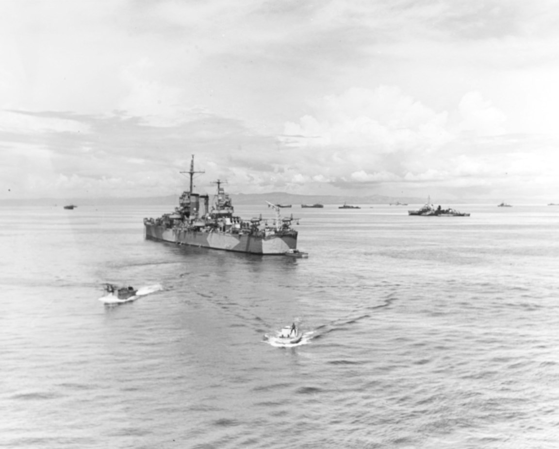 Cruiser USS Nashville, General Douglas MacArthur’s flagship during the Leyte Gulf operations, at anchor off Leyte, Philippine Islands, about 21 Oct 1944. Note destroyer USS Bush at right.