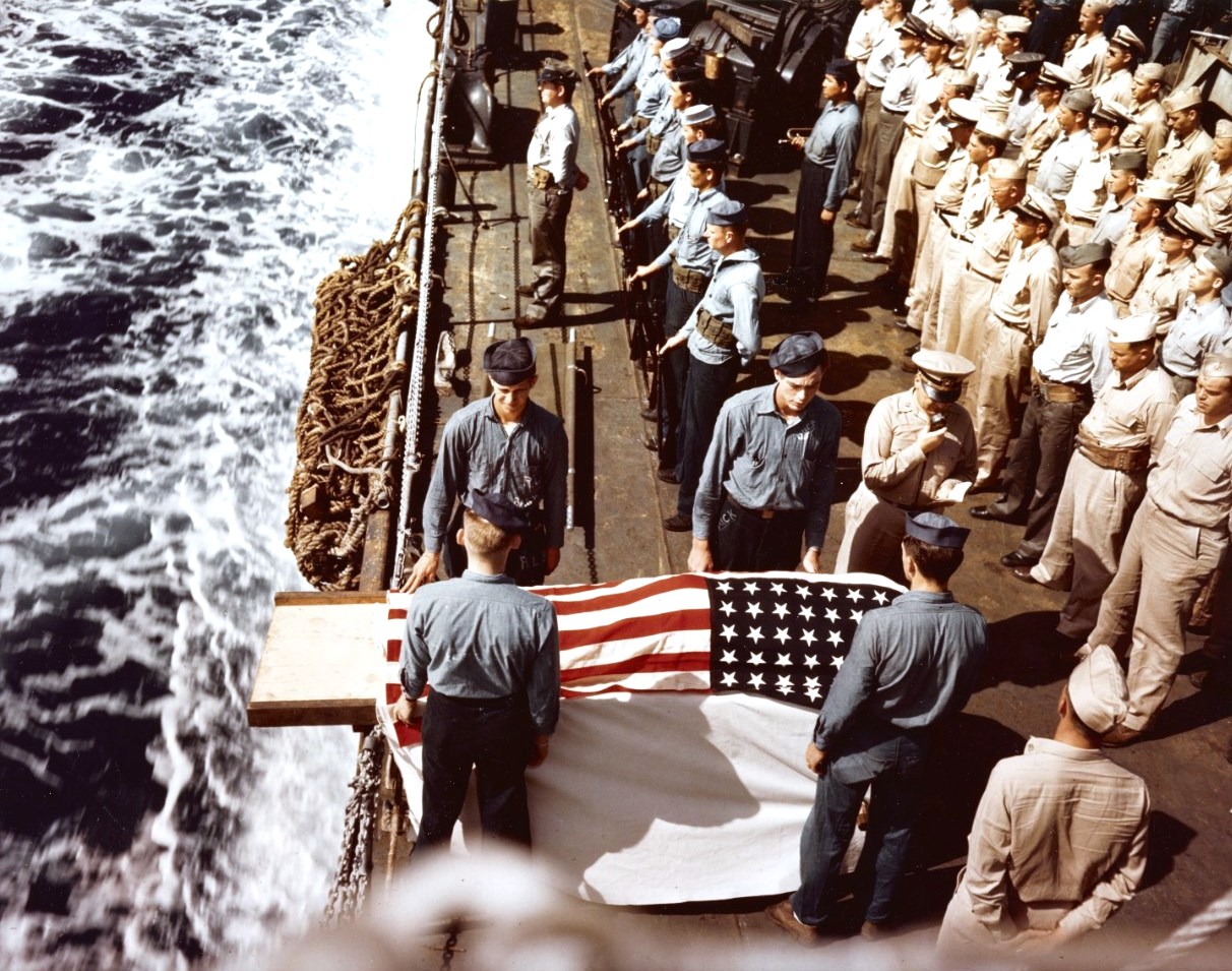 Burial at sea for a casualty of the battle for Iwo Jima aboard troop transport USS Hansford while she was evacuating wounded men to Saipan, 25-28 February 1945.