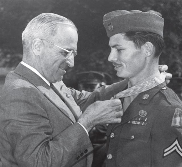 President Truman presenting the Medal of Honor to medical corpsman Desmond Doss at the White House, Washington DC, 12 Oct 1945. The medal was for actions on Okinawa, Japan. Photo 2 of 3.