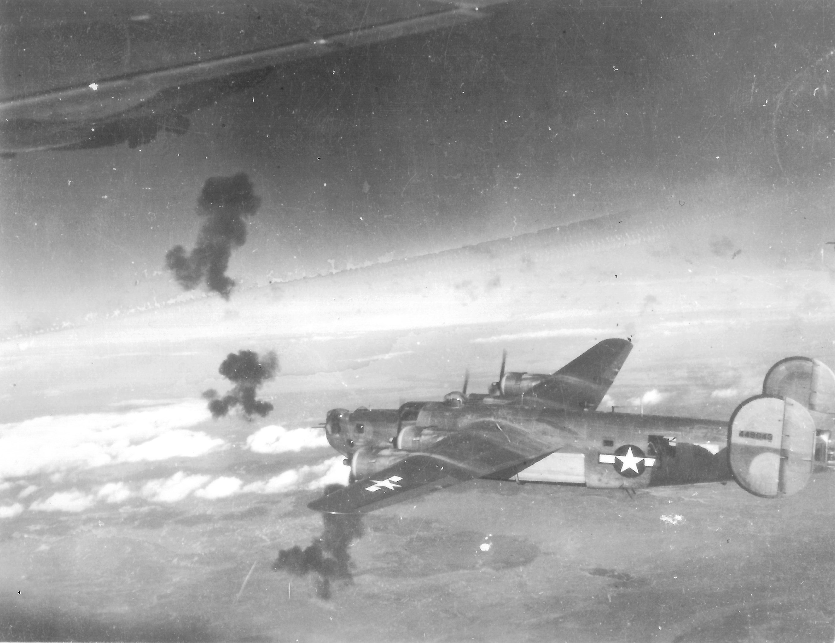 B-24L Liberator “Short Stuff” with the 727th Bomb Squadron flying through flak on its bomb run over their target between Dec 1944 and Feb 1945. Note the open bomb bay doors.