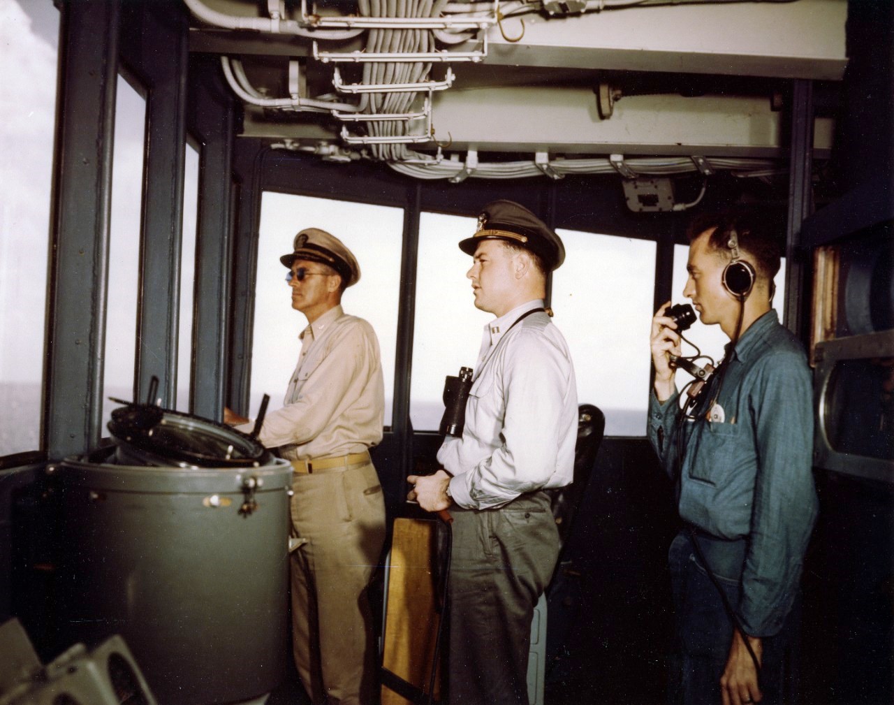 Bridge watch aboard the USS Missouri during the battleship’s shakedown cruise to Trinidad, Aug 1944: commanding officer Capt William M Callaghan, Officer of the Deck Lt Morris R Eddy, and Yeoman 1st class Arthur Colton