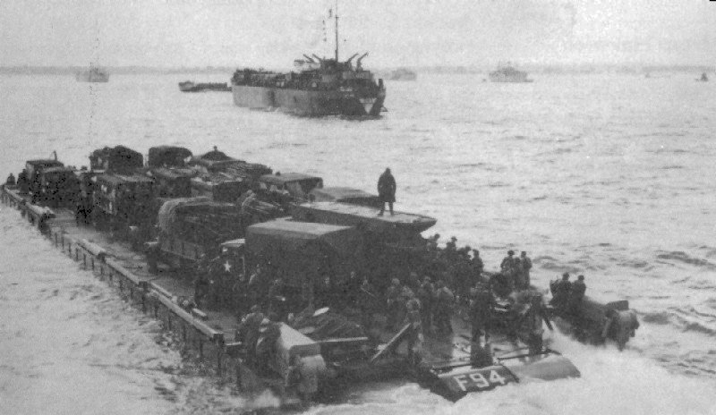 Rhino ferry F94 moving away from HMS LST-320 heading for the Normandy beachhead along the port side of HMS LST-412, France, Jun 1944