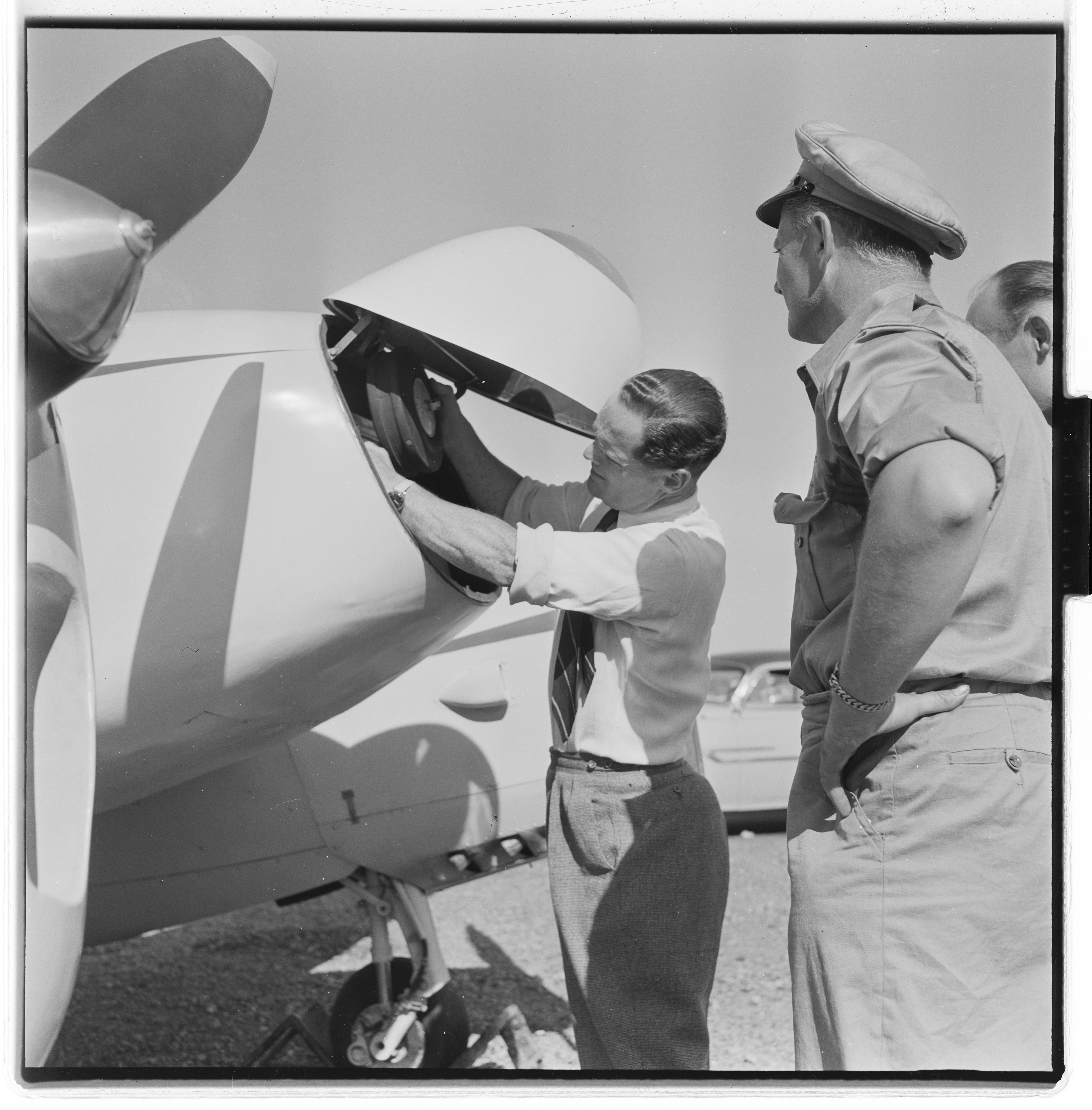 Douglas Bader inspecting a Norwegian Gemini aircraft, Fornebu, Bærum, Akershus, Norway, 1955, photo 1 of 8