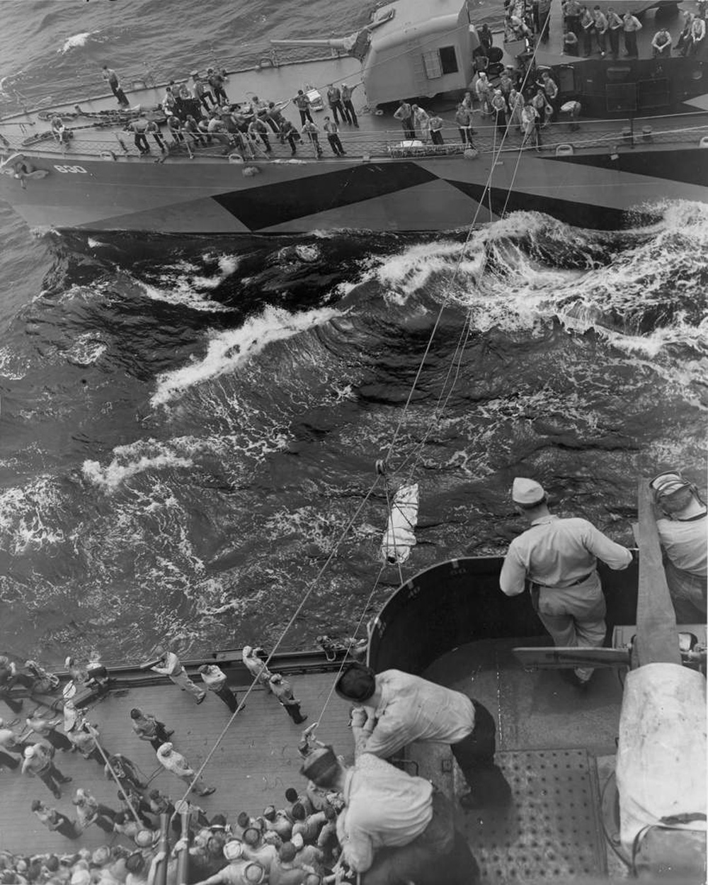 USS Braine transferring wounded to USS New Mexico, 14 Jun 1944