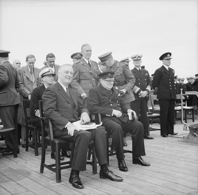 Roosevelt and Churchill at the Atlantic Charter Conference, Placentia Bay, Newfoundland, 10-12 Aug 1941, photo 2 of 2; Hopkins, Harriman, King, Marshall, Dill, Stark, and Pound behind them