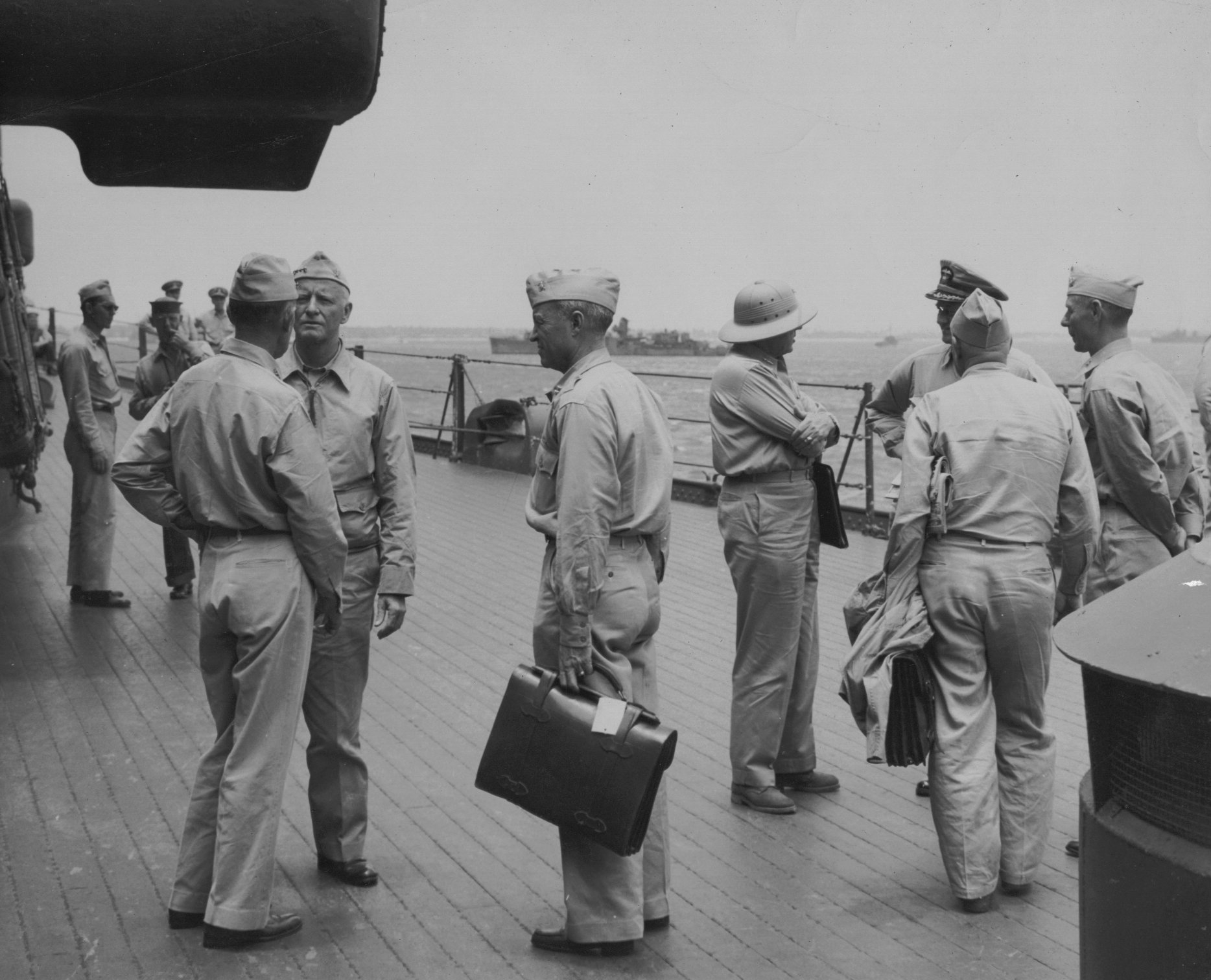 Admiral Raymond Spruance and Admiral Chester Nimitiz aboard USS New Jersey, date unknown, photo 2 of 4; note Robert Elliott in background, touching face