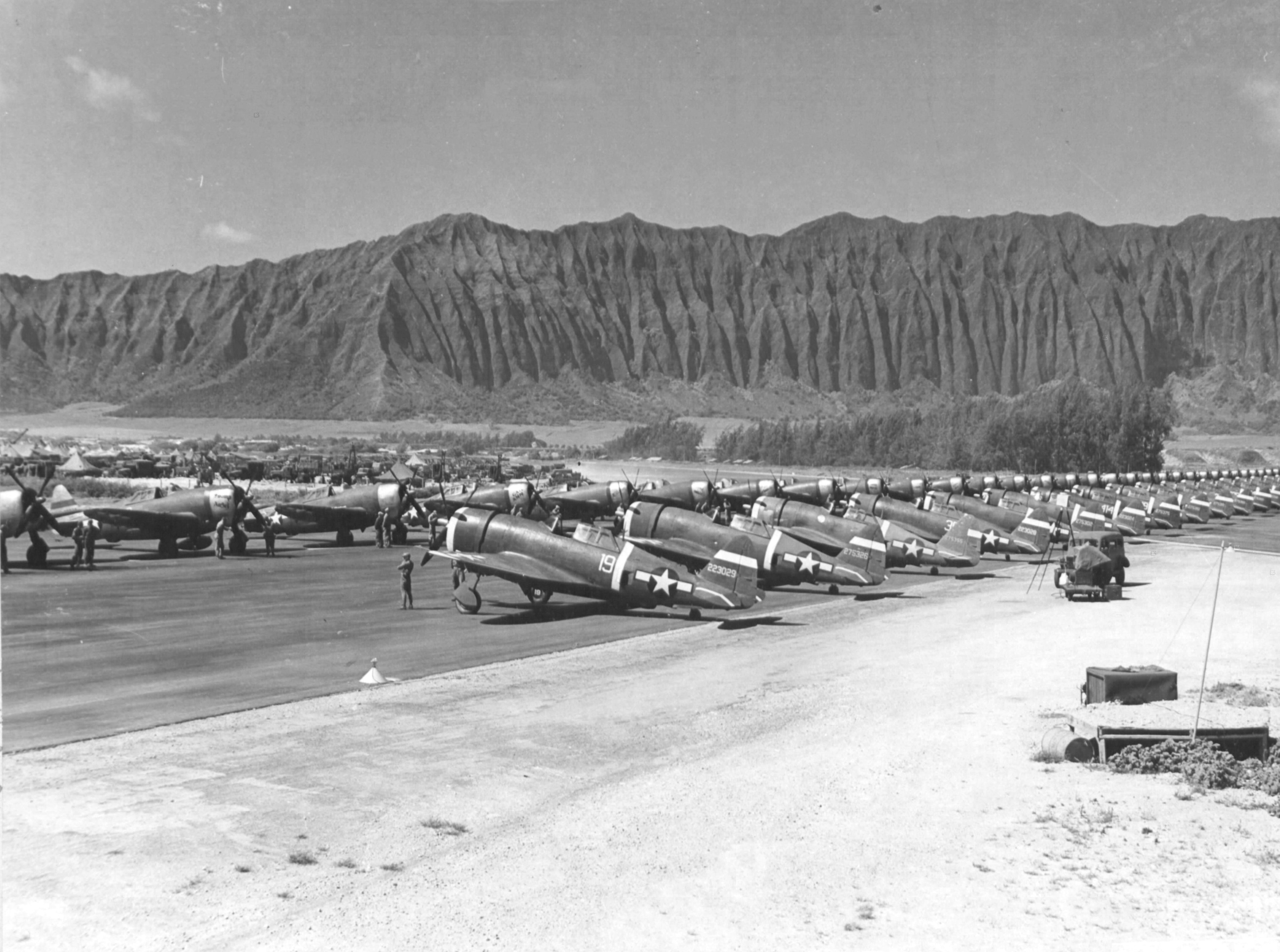 P-47 Thunderbolt aircraft of the 318th Fighter Group lined up for an inspection at Bellows Field, Oahu, US Territory of Hawaii, 15 May 1944. Photo 2 of 8.