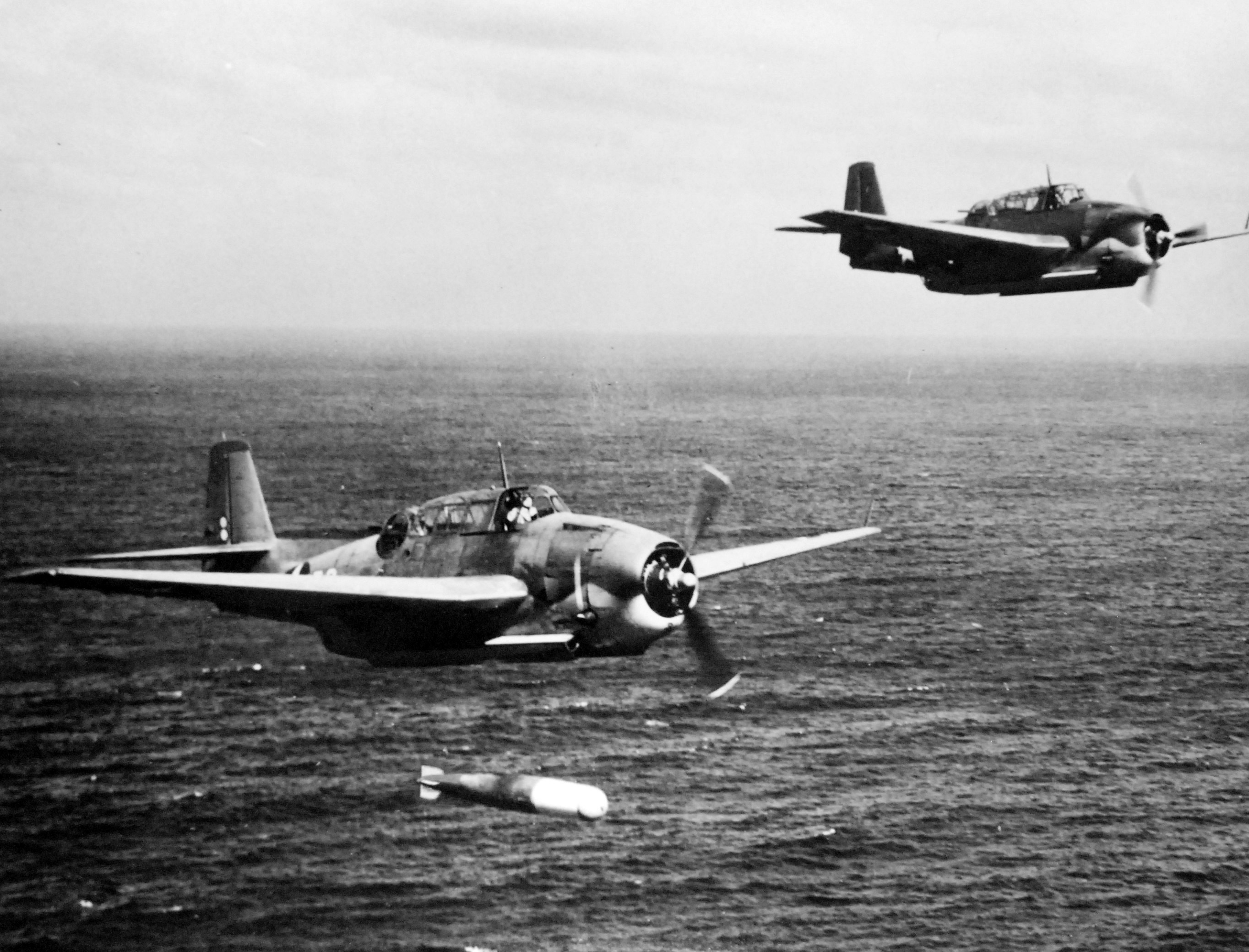 A training flight of TBF-1 Avengers lining up to drop practice torpedoes, late 1942, off the east coast of the United States. Photo 4 of 4.