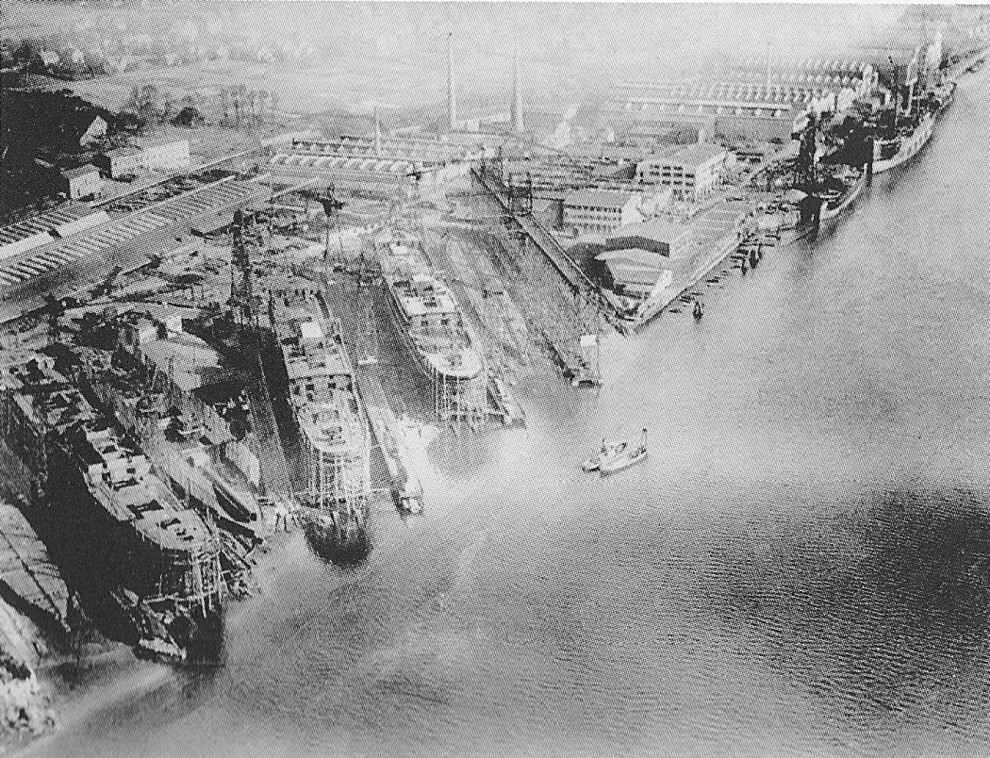 Overhead view of Bremer Vulkan slips and equipping pier, Bremen, Germany, circa 1930