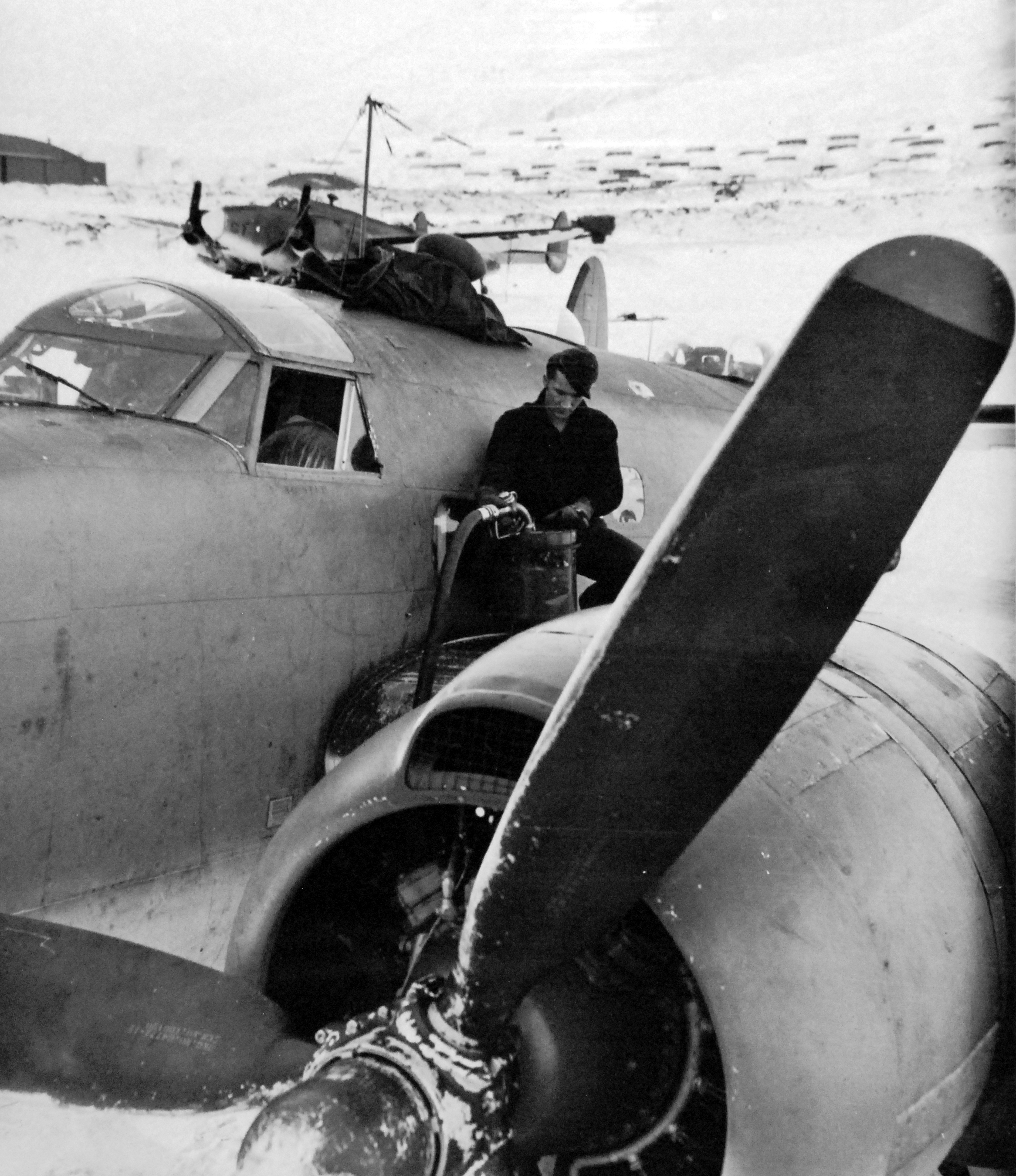PV-1 Ventura with Fleet Air Wing 4 being refueled at Attu, Aleutians, Alaska, 15 Feb 1945. The crewman is Aviation Machinists Mate-3rd class J.W. Waitaneke.