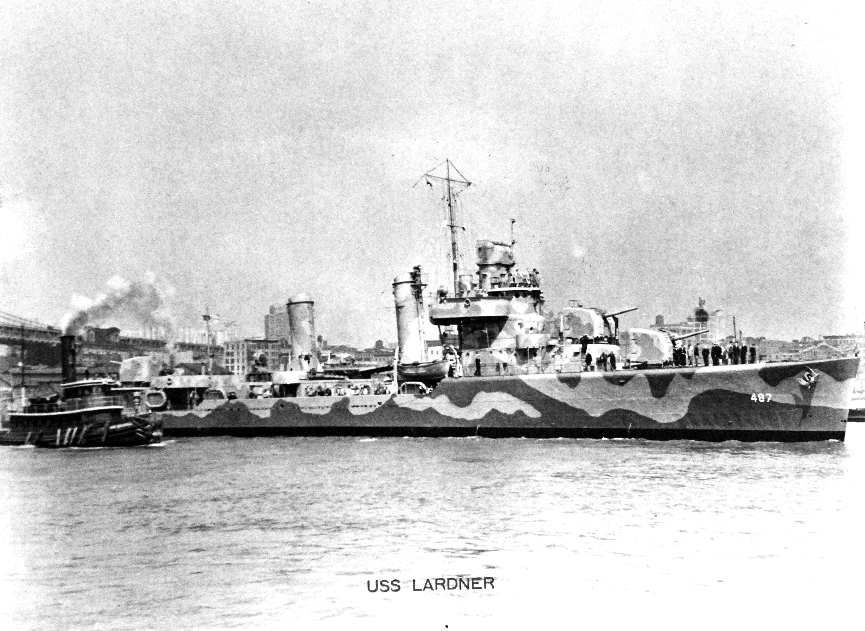 Destroyer USS Lardner, assisted by the tug Captain Seawall, makes her way across New York Harbor, May 1942. Lardner wears Measure 12 (modified) paint scheme.