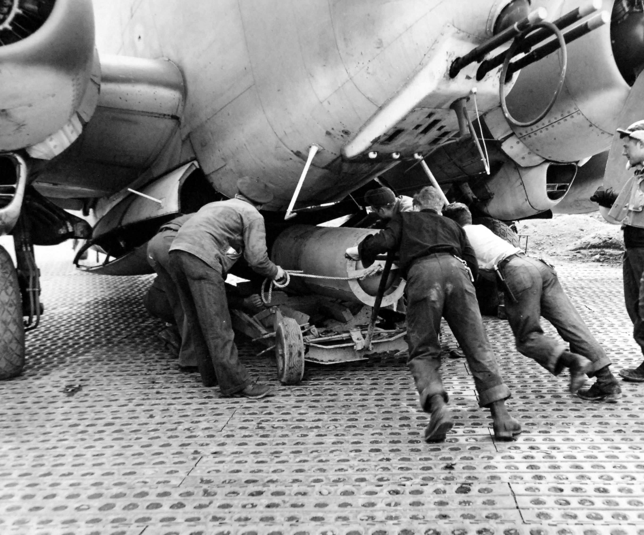 Mark XIII torpedo with wooden drag ring being loaded into a United States Navy PV-2 Harpoon of Patrol Bombing Squadron VPB-139 at Casco Field, Attu Island, Aleutians, Alaska, 7 Apr 1945. Note the Marsden Matting.
