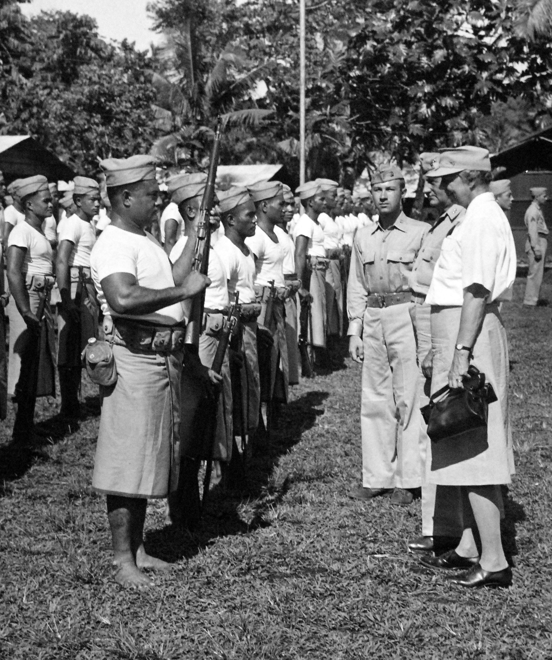 First Lady Eleanor Roosevelt inspecting “native” Samoan Marines at Tutuila, Samoa, 23 Aug 1943. Also present are United States Marine MGen C.F.B. Price, Commanding General of the area and Captain John R. Napton, Jr.