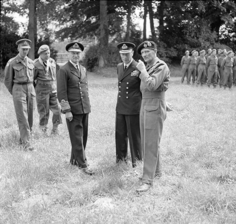 Following a presentation of medals, Royal Navy Admiral Sir Bertram Ramsay, King George VI of the United Kingdom, and General Bernard Montgomery pause briefly, 16 Jun 1944, Château de Cruelly, France.