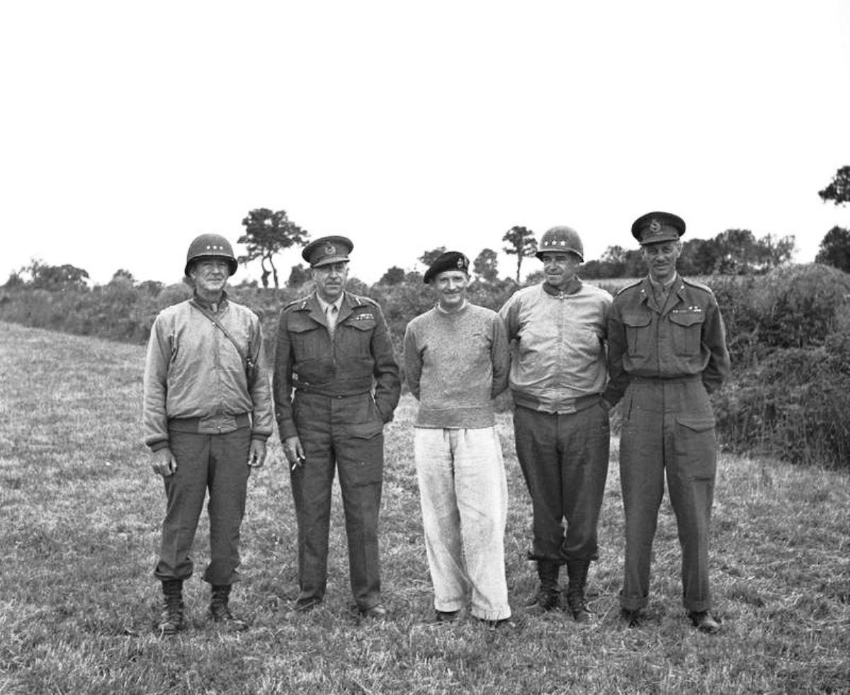 Generals Courtney Hodges, Henry (Harry) Crerar, Bernard Montgomery, Omar Bradley, and Miles Dempsey after a tactical meeting in a Normandy hayfield, 21 Aug 1944.