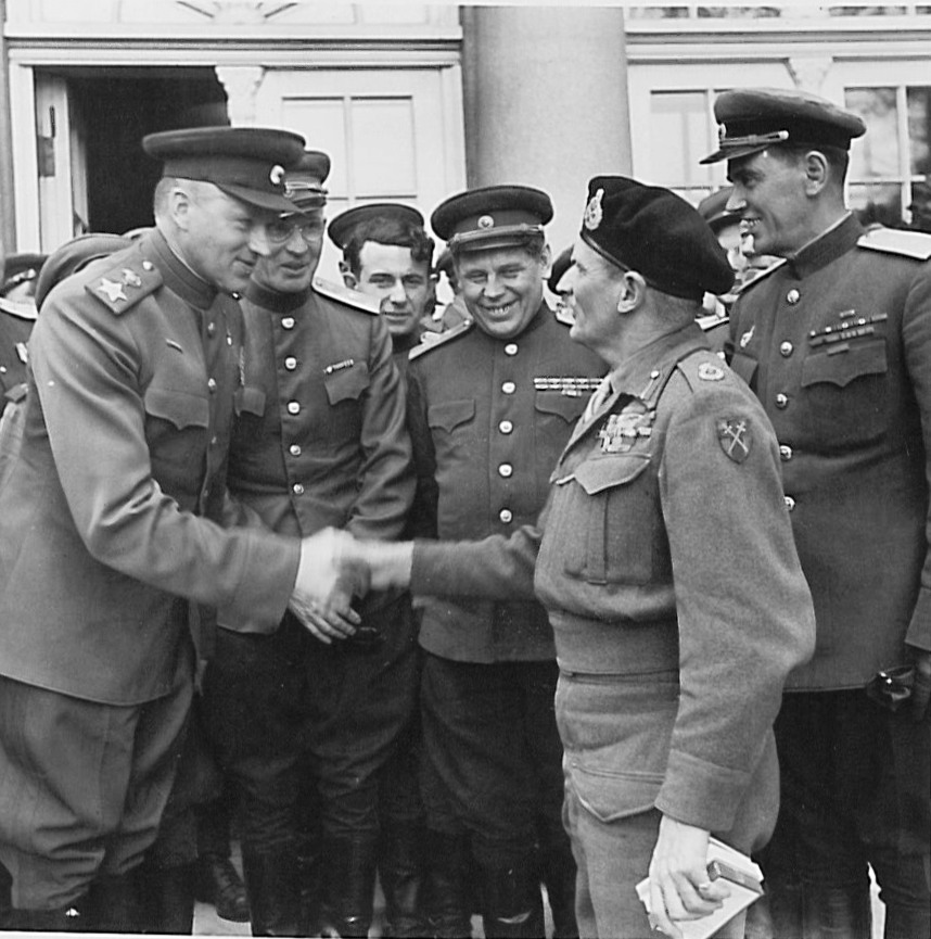 Soviet General Konstantin Rokossovsky, left, greeting British Field Marshal Bernard Montgomery, right, during a visit to Rokossovsky’s headquarters in Wismar, Germany, 7 May 1945.