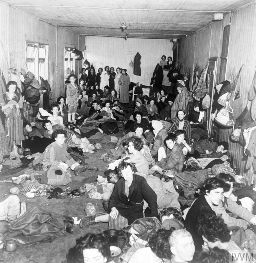 Emaciated prisoners at the Bergen-Belsen Concentration Camp huddled into a room, 17 Apr 1945.