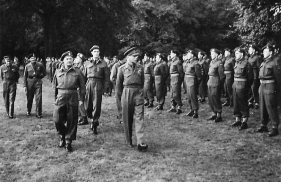King George VI of the United Kingdom reviewing a British Army honor guard near Nijmegen, Netherlands, 13 Oct 1944.