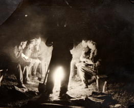 German soldiers around a camp fire, date and location unknown