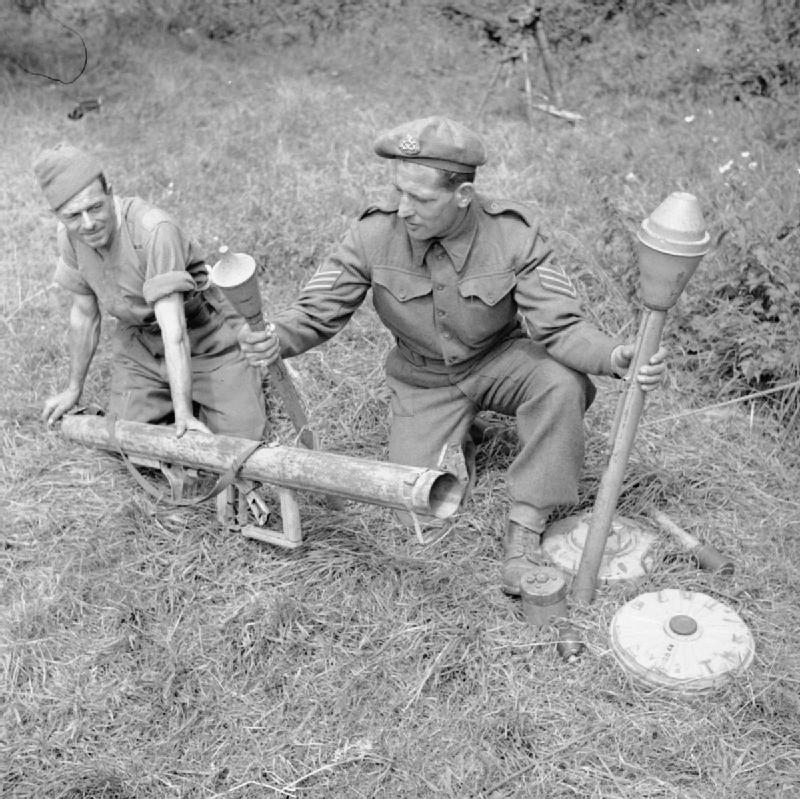 Demonstration of a captured German Panzerschreck weapon by an instructor of UK 59th Division, France, 1 Aug 1944