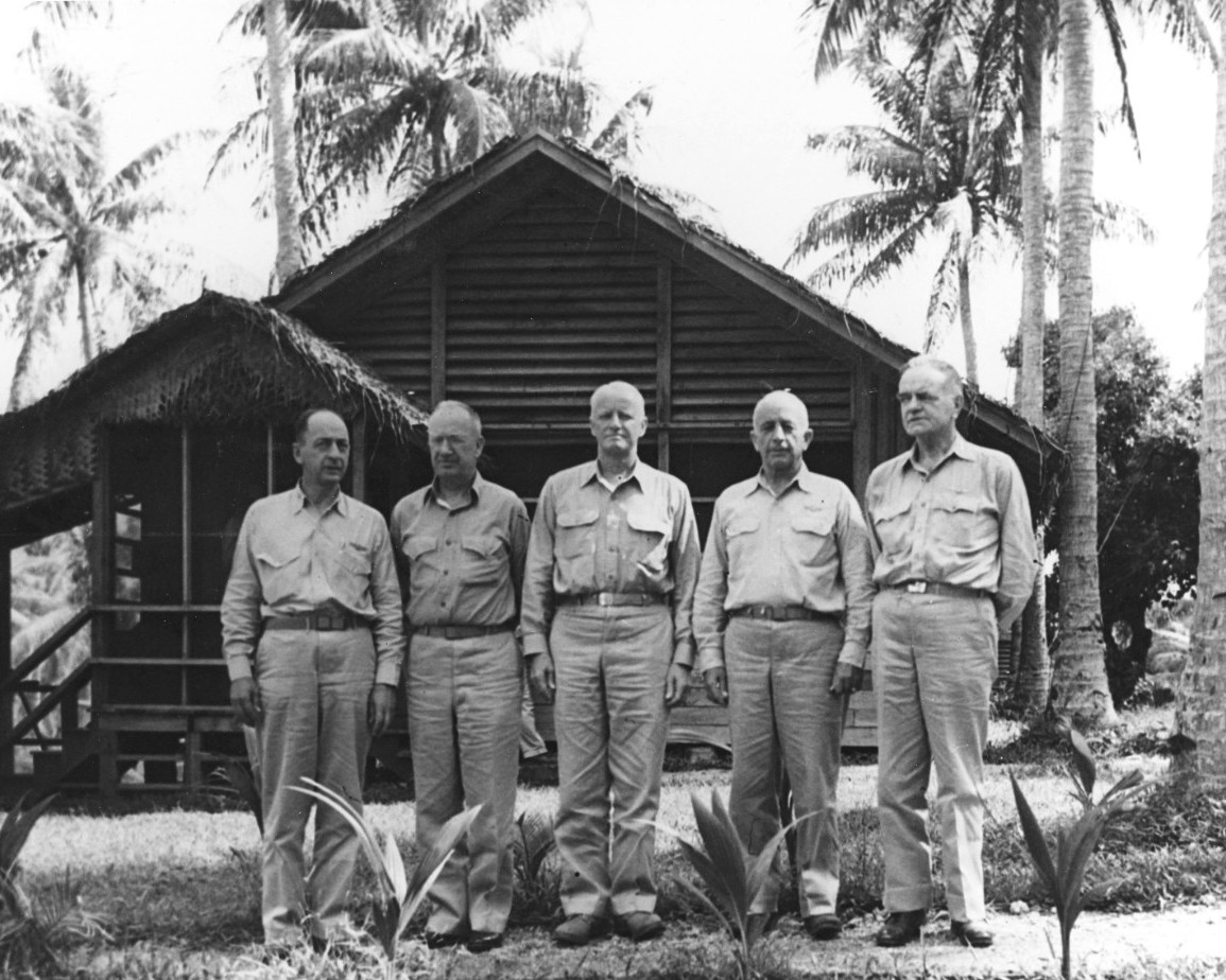 Headquarters of Commander, Air, South Pacific on Espiritu Santo, New Hebrides, 16 Jun 1943, with USMC MGen Ralph Mitchell, USMC MGen Holland Smith, Adm Chester Nimitz, VAdm Aubrey Fitch, and Adm William Halsey in front.