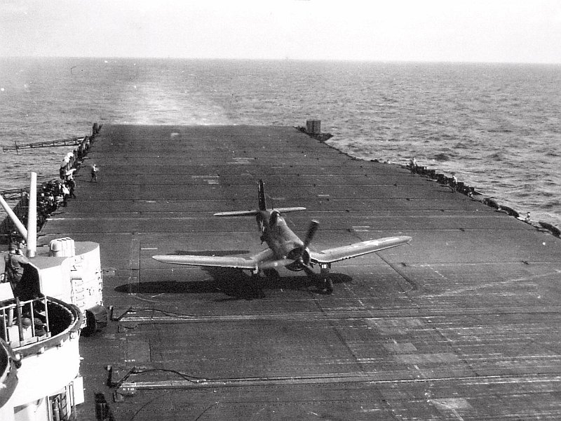 F4U Corsair at the barrier wires after landing aboard USS Bennington around Okinawa in the Western Pacific, Apr 1945.