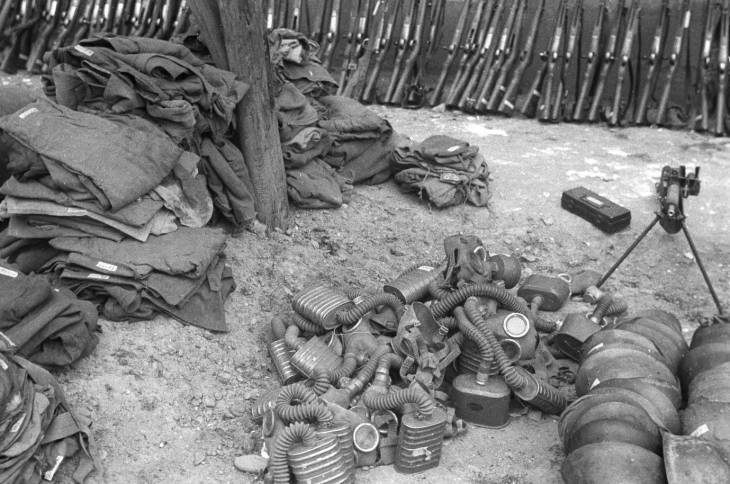 Captured Japanese clothing, Type 91 or Type 95 gas masks, helmets, and Type 11 machine gun, Changde, Hunan Province, China, 25 Dec 1943