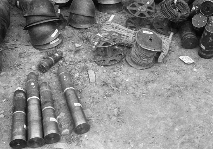 Captured Japanese helmets, wires, and shells, Changde, Hunan Province, China, 25 Dec 1943