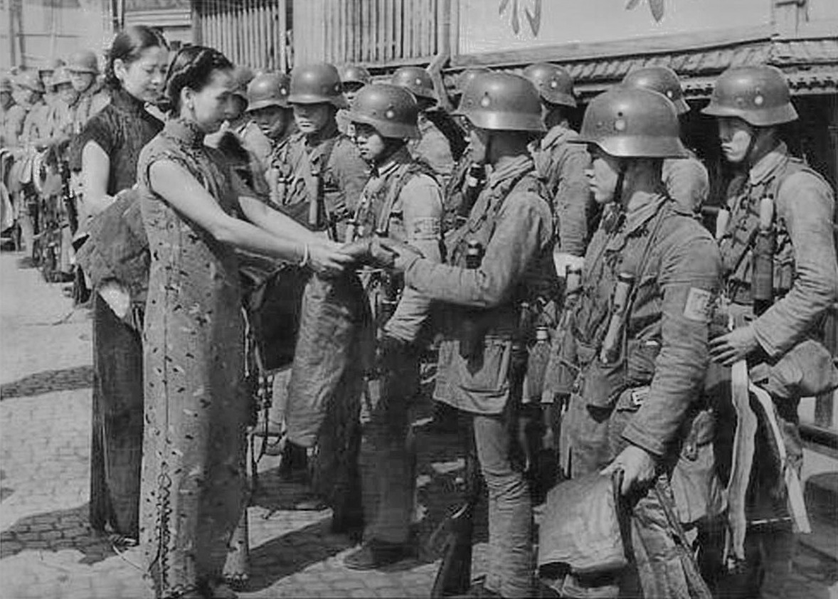 A representative from a Shanghai women's association donating clothing to Chinese troops, Shanghai, China, circa Aug 1937, photo 1 of 2