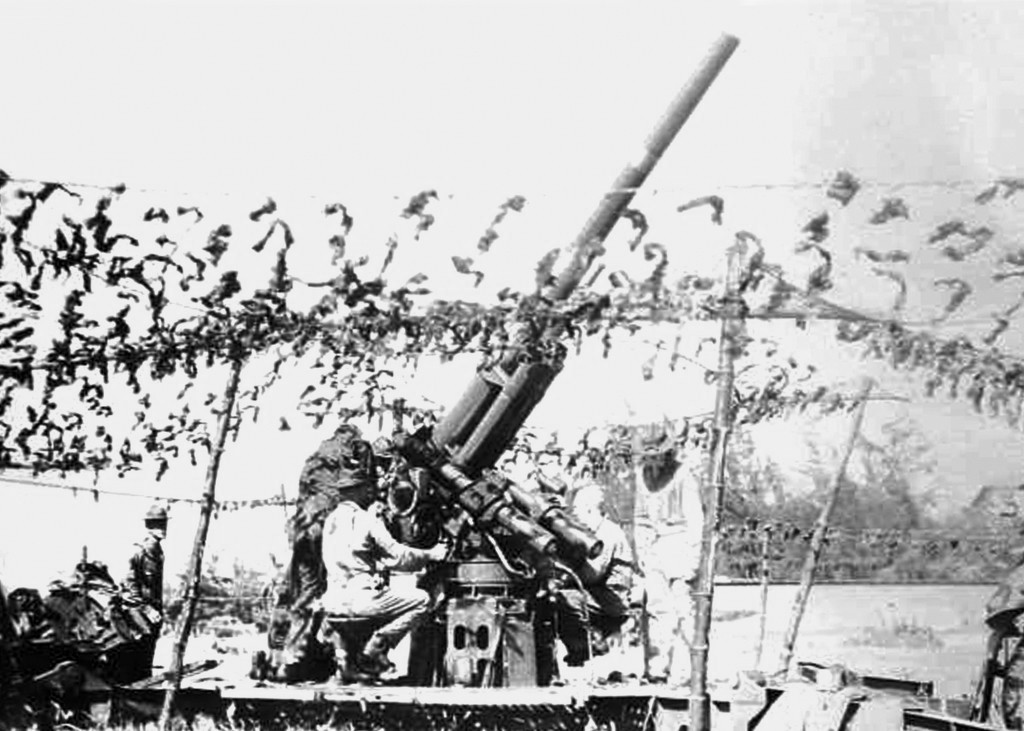 Soldiers drill at a 3-inch anti-aircraft defense gun protecting the Borinquen Field, Puerto Rico, 1940.