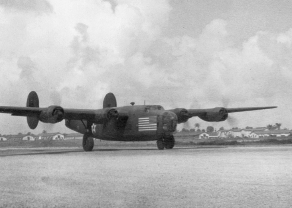C-87 Liberator (cargo variant of the B-24) at Borinquen Field, Puerto Rico, 1941 as part of the “Arabian Knight” route-mapping operation. Note the large flag marking used as neutrality markings in pre-war 1941.