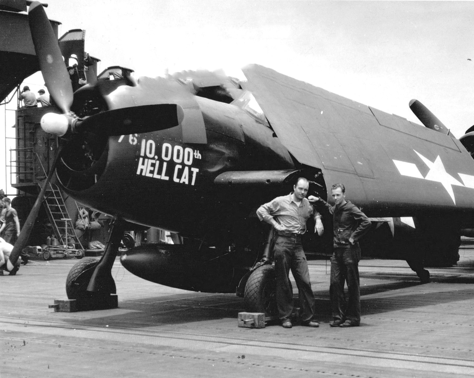 Crewmen in front of Grumman F6F-5 Hellcat “10,000th Hellcat” BuNo 78854 of Fighting-Bombing Squadron VBF-87 aboard USS Ticonderoga, May-Jun 1945 in the western Pacific.