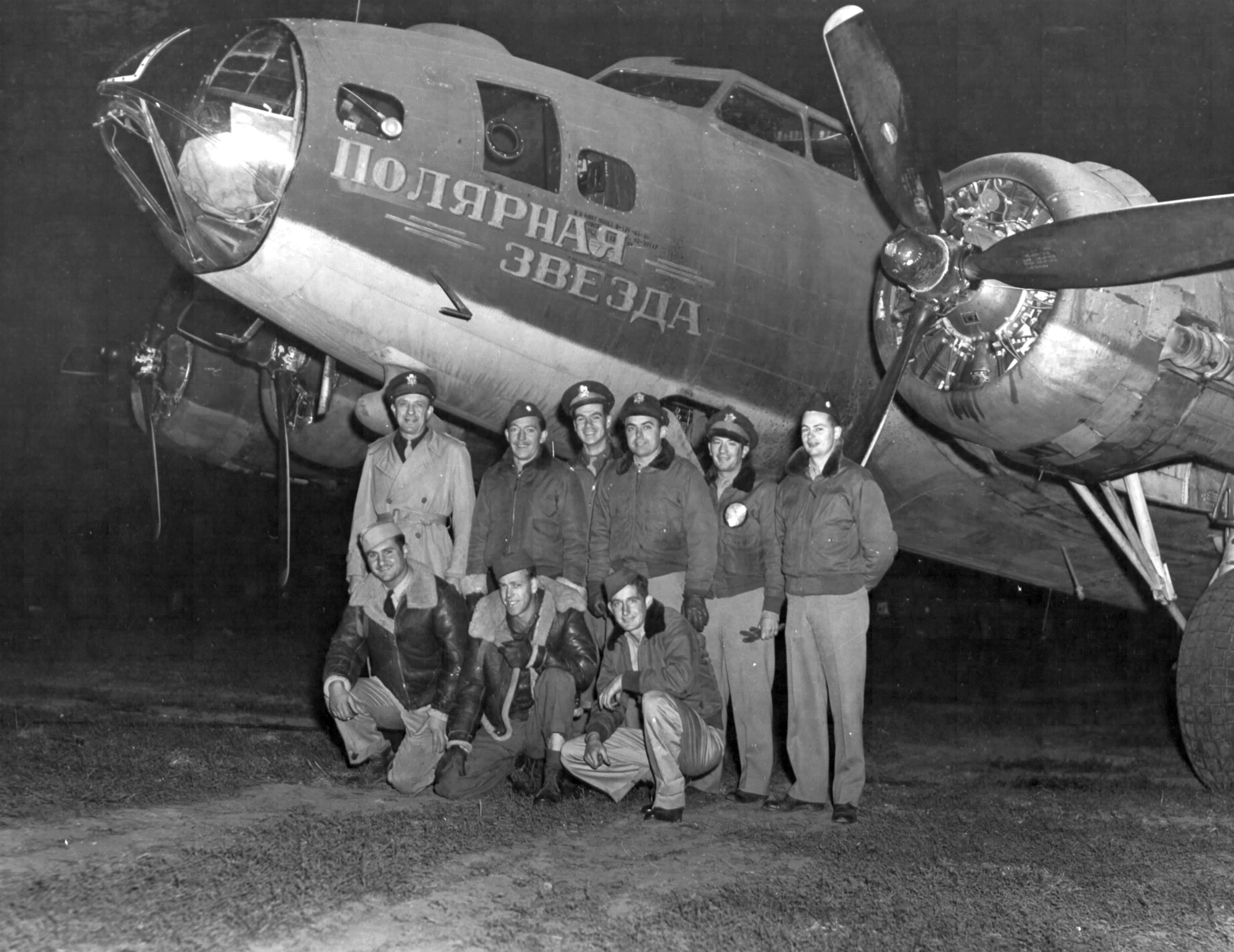 Crew of B-17F Fortress #42-30117 with the 95th Bomb Group posing in front of their airplane at Poltava, Ukraine during an Operation Frantic shuttle mission, summer 1944. The aircraft name translates to Polar Star.