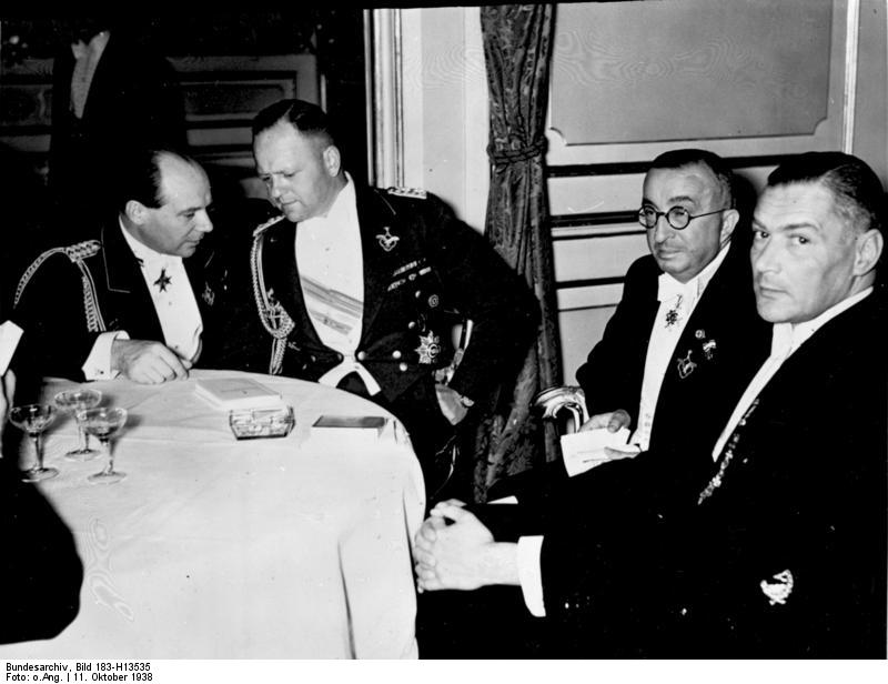 Ernst Udet, Erhard Milch, and Ernst Heinkel, and an unidentified man at a Lilienthal Society event at the Neuen Palais in Potsdam, Germany, 11 Oct 1938