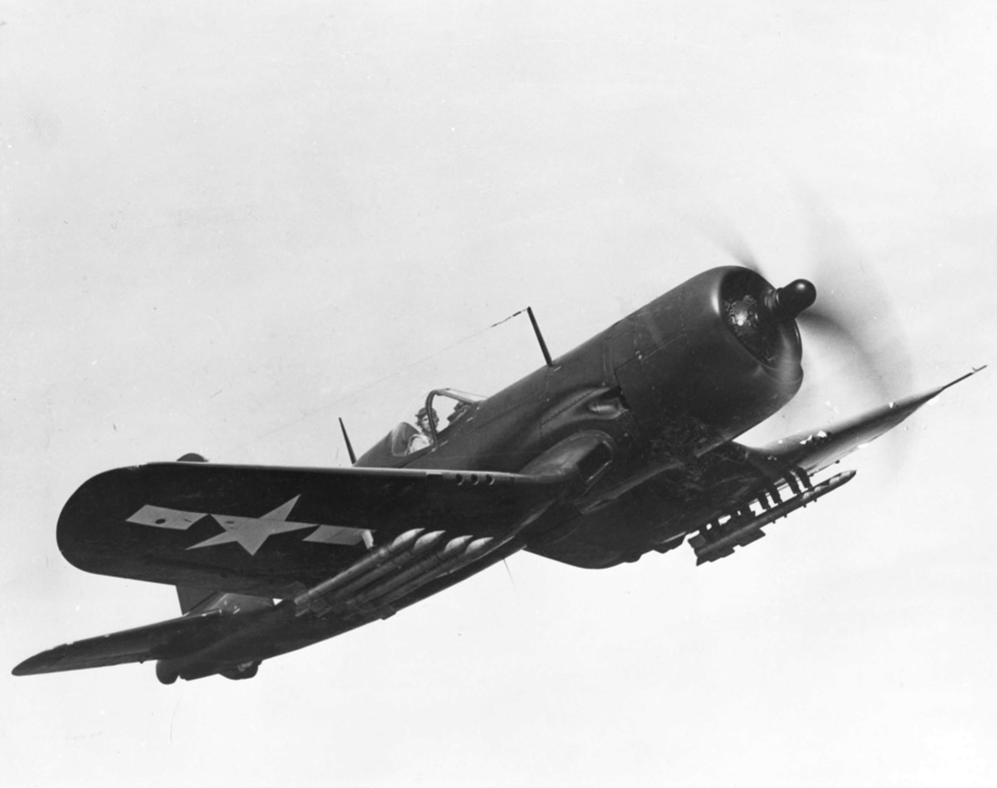 Vought F4U Corsair in flight, mid-1944, location uncertain. Note wing mounted HVAR air-to-surface rockets.