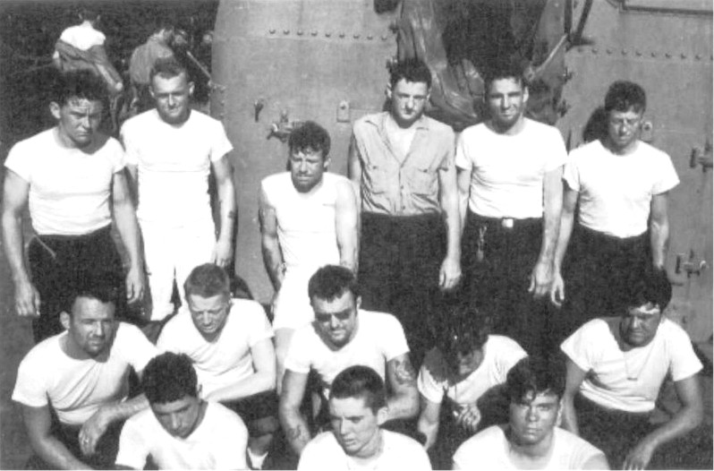 All 14 men from the USS Spence rescued by the USS Tabberer gathered on Tabberer’s quarterdeck after arrival at the Ulithi anchorage, 22 Dec 1944.