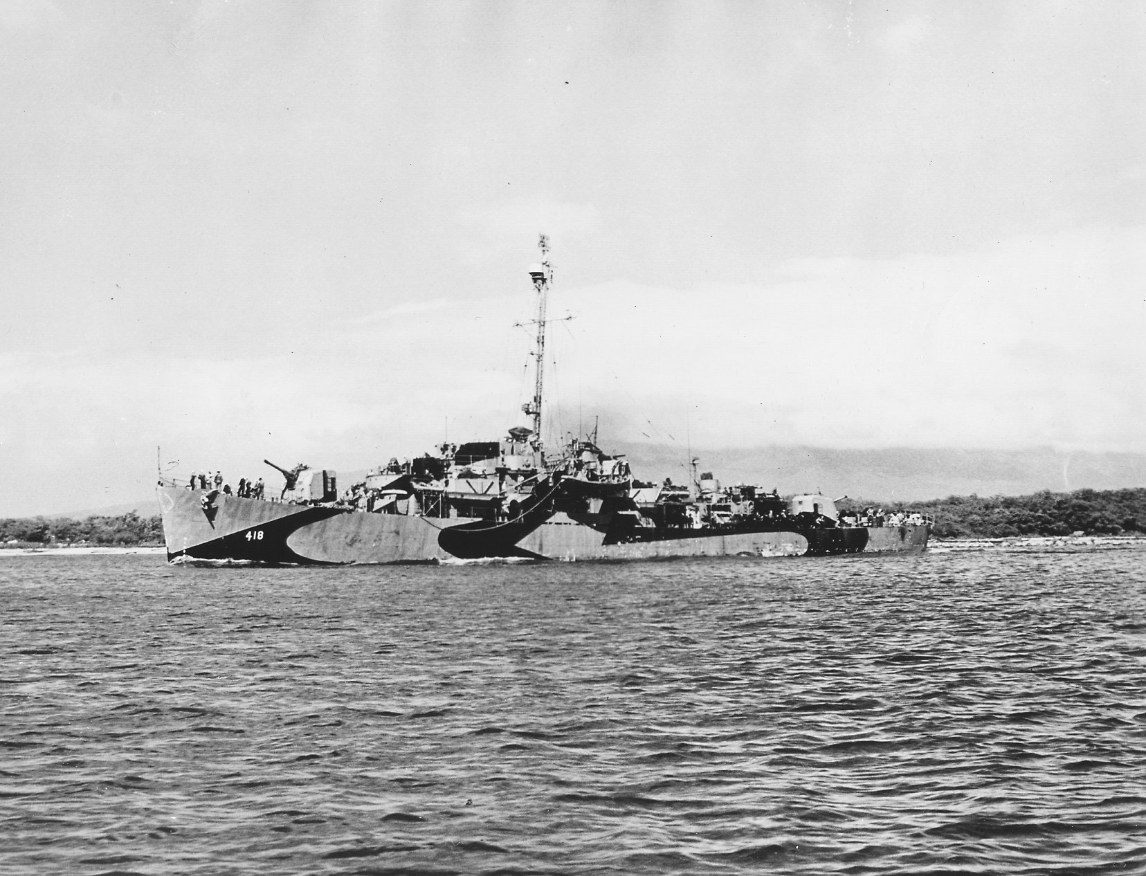 Destroyer escort USS Tabberer in her Measure 31, Design 22D paint scheme in late 1944, probably Hawaii.