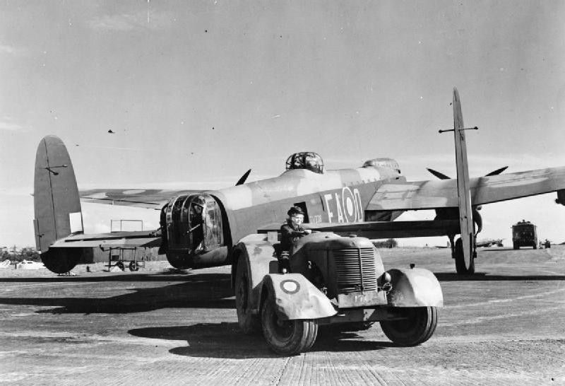 Leading Aircraftwoman Lilian Yule tractoring a Avro Lancaster B Mark III bomber of No. 49 Squadron RAF to its dispersal slot at RAF Fiskerton, Lincolnshire, England, United Kingdom, 1942-1944; this bomber, DV238, was later lost during a raid on Berlin, Germany during the night of 16-17 Dec 1944 with No. 44 Squadron RAF