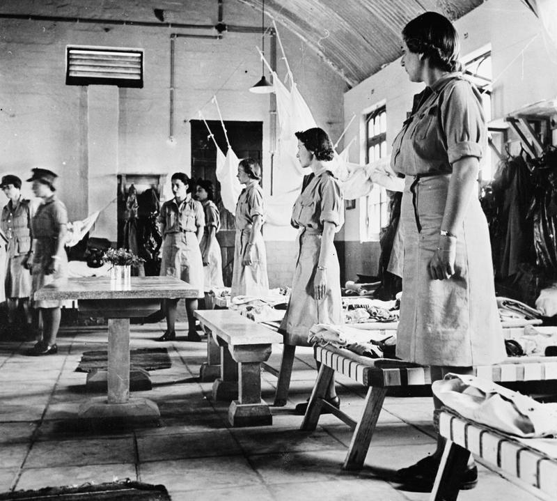 WAAF recruits standing by their beds during a kit inspection, Egypt, date unknown