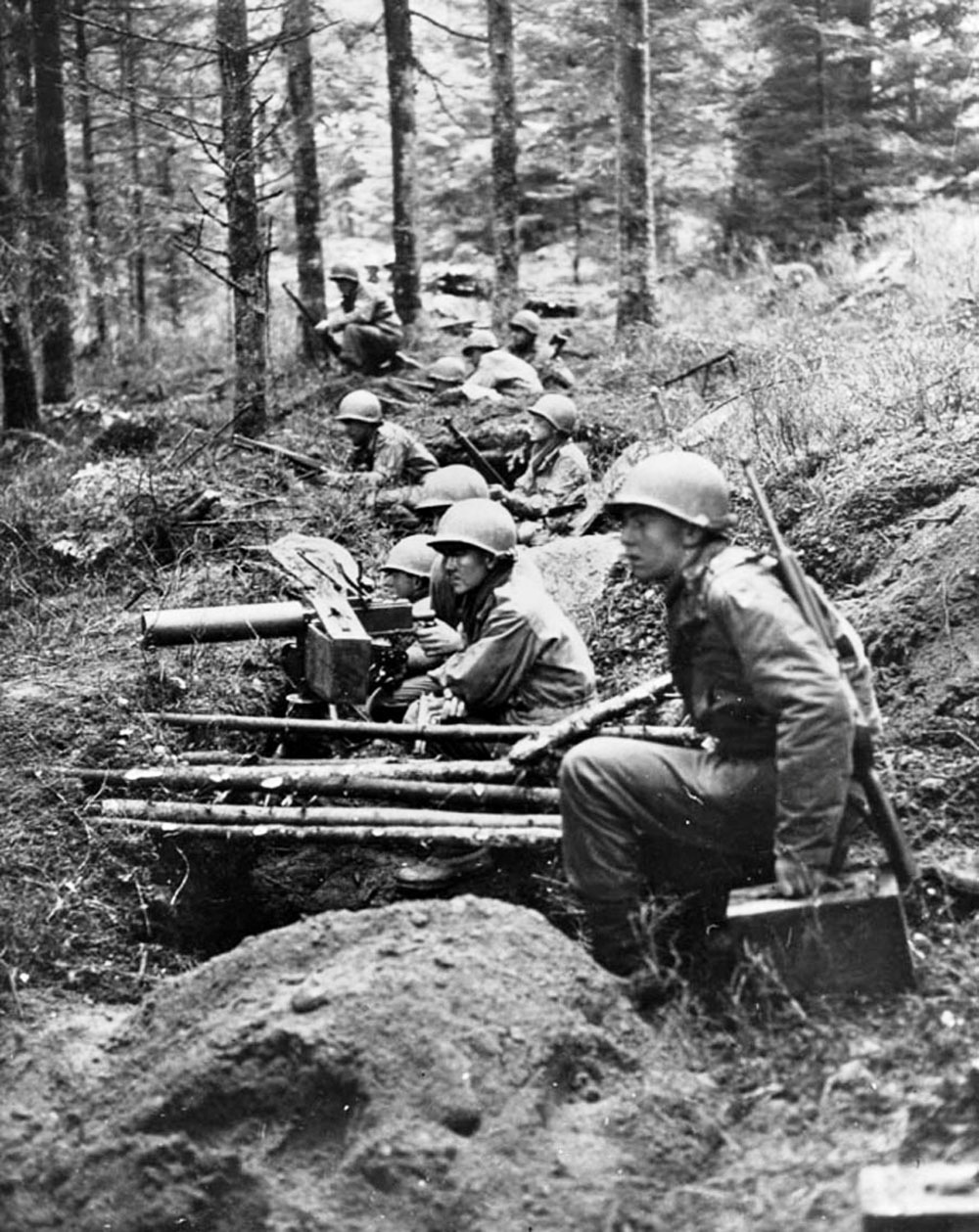 Members of the US 22nd Infantry Regiment holding the line during heavy fighting near Großhau, Germany during the Battle of the Hürtgen Forest, 1 Dec 1944. Note the M1917 machine gun and M1 Garand rifles.