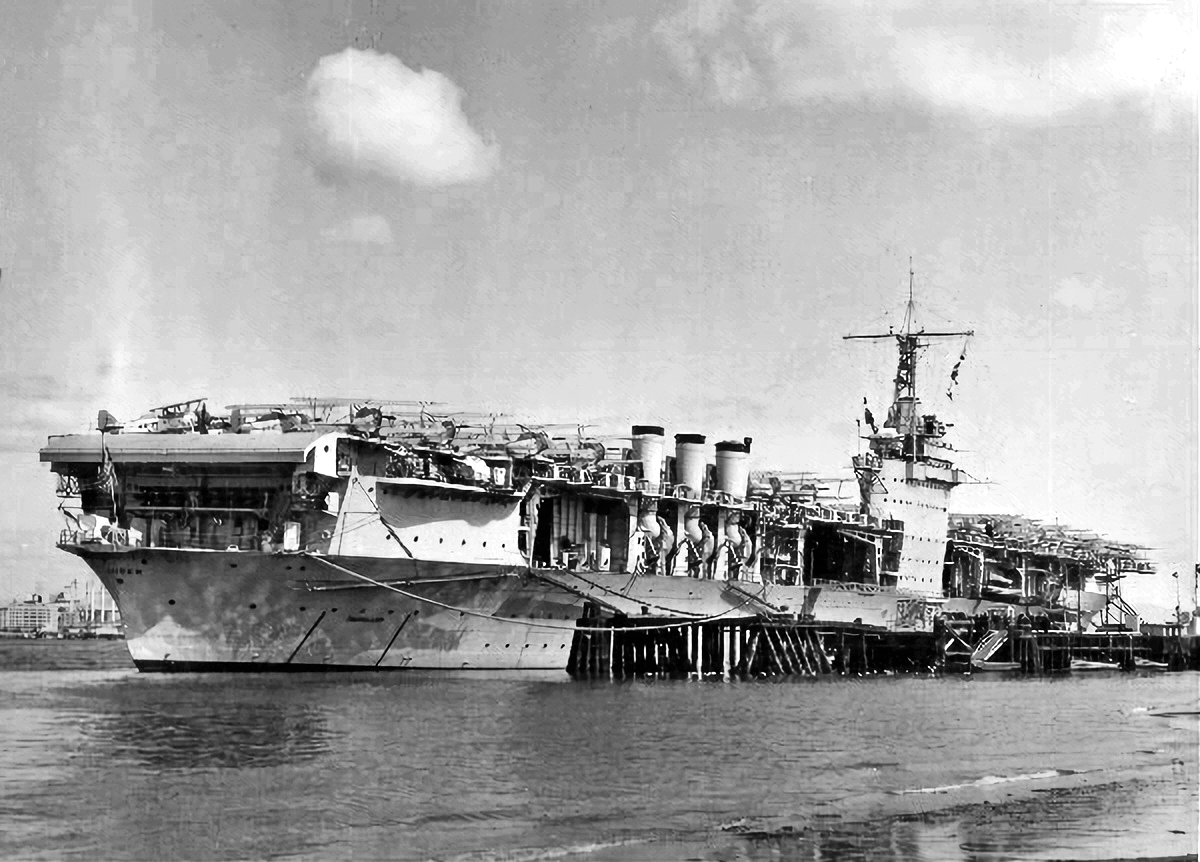 USS Ranger at North Island, San Diego, California, United States, 14 Mar 1938. Note the bends in the stacks that allow them to swing outboard for flight operations.