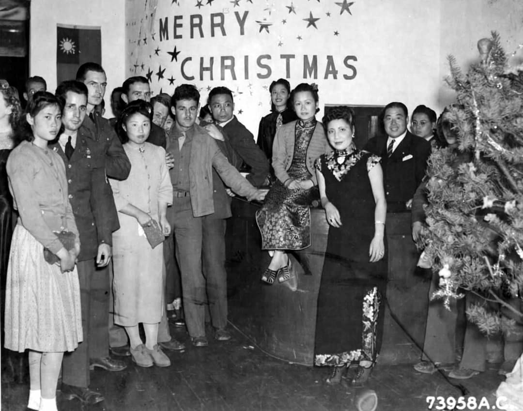 US servicemen and Chinese civilians at a Christmas party, Kunming, Yunnan Province, China, 24 Dec 1942