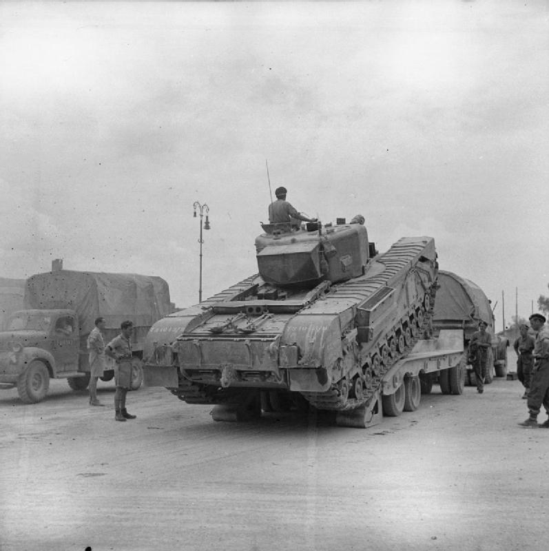 A Churchill infantry tank being unloaded from a Diamond T tank transporter, Arezzo, Italy, 19 Jul 1944 Best