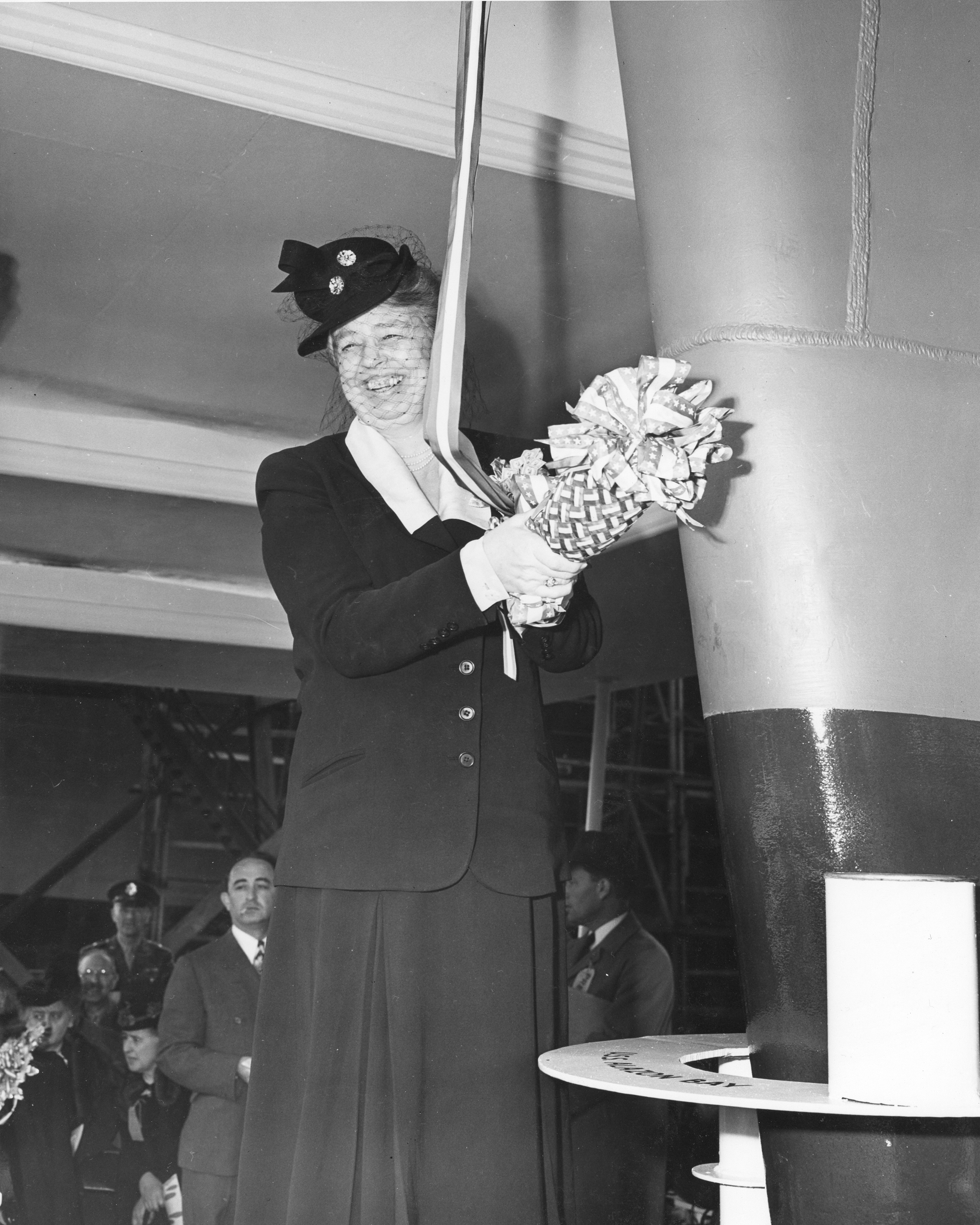 First Lady Eleanor Roosevelt preparing to christen the USS Casablanca, the lead ship in a new class of escort carriers, 5 Apr 1943, Kaiser Shipyards, Vancouver, Washington, United States.