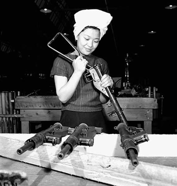 Chinese-Canadian worker Agnes Wong assembling a Sten gun at the Small Arms Ltd. plant, Mississauga, Ontario, Canada, circa Apr 1944