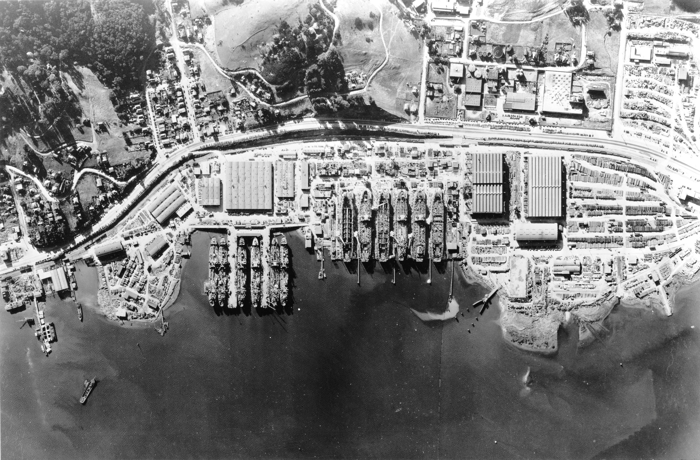 Aerial view of the Marinship Shipbuilding yard, Sausalito, California, United States, 6 Dec 1944. Note the six tankers under construction on the ways and six others being fitted out at the piers. Photo 5 of 5.