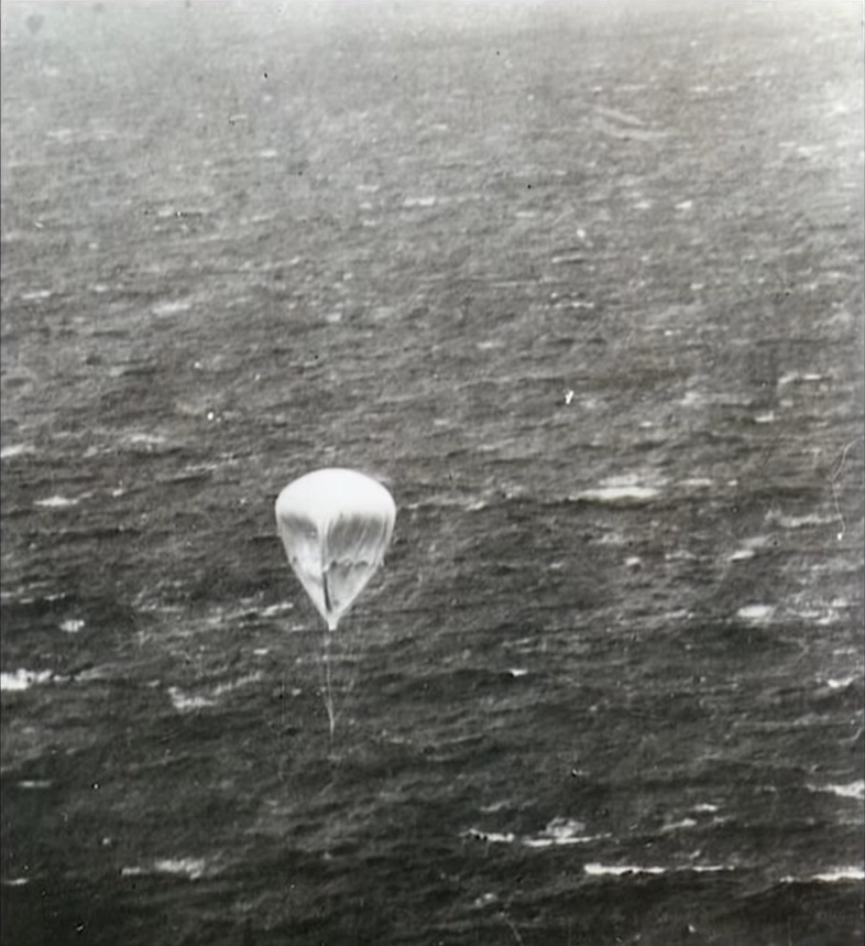 United States Army photo of a partially deflated Japanese Fu-Go balloon bomb over the Pacific Ocean, likely near the Aleutian Islands. This shows why these descending balloons were often mistaken for parachutes.