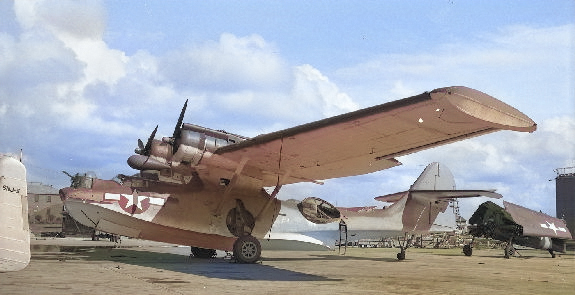 PBY-5A Catalina and F6F Hellcat on the pad at Naval Air Station Alameda, California, United States, 1947. Note that the Hellcat’s engine has been removed. [Colorized by WW2DB]