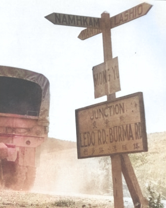 Sign post at Mong Yu, Burma (now Myanmar) at the Chinese border marking the joining of the newer Ledo Road with the previous Burma Road, 1945 [Colorized by WW2DB]